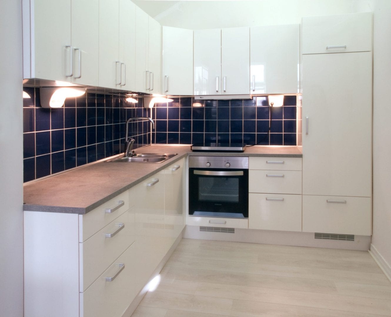 Kitchen Units installed with Dark Blue Tiling Fitted in Kent